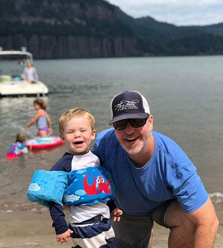 Doug Holt with son on sea